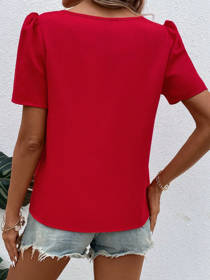 Blusa unicolor con abertura