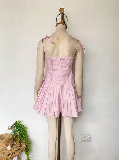 Vestido rosa dulce de tirantes con lazo